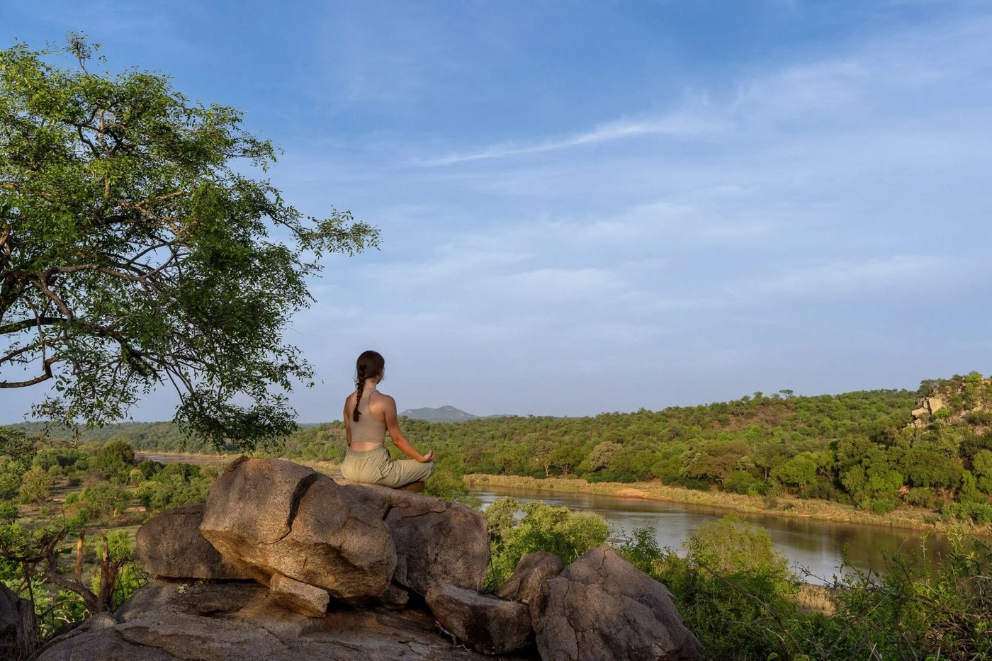 A guest meditating on a rock above the Olifants River, Sashwa River of Stars
